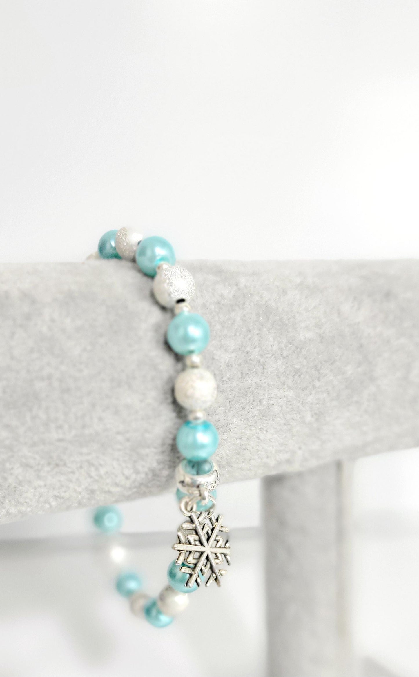 Ice blue glass beaded snowflake charm bracelet