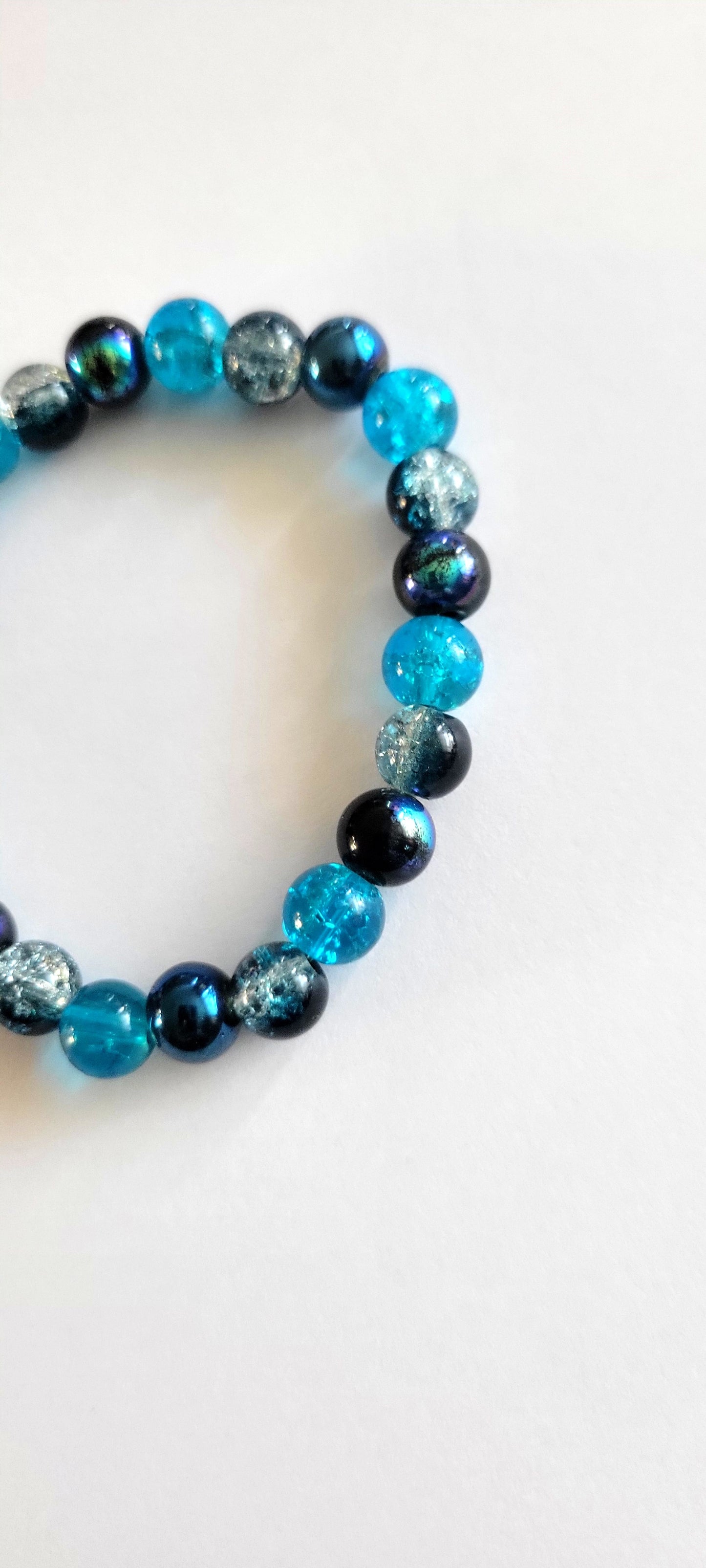 Aurora Borealis Blue 8mm Glass Beaded This beautiful two-toneStretch Bracelet 7"
